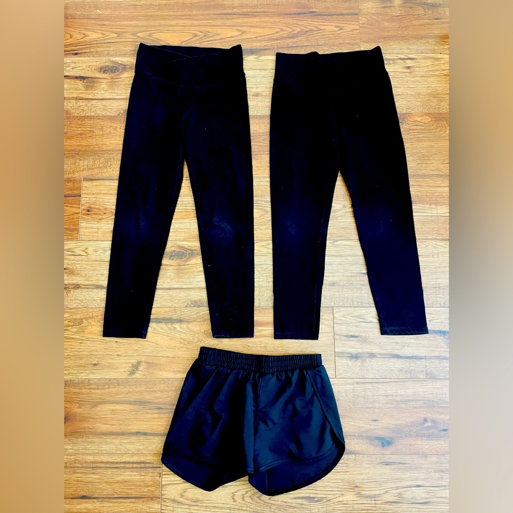 Youth girls sportswear.  2 leggings, 1 black shorts.  Size 8